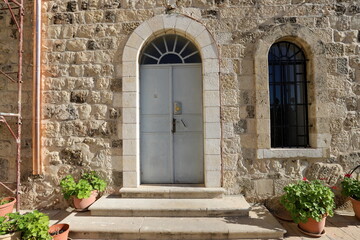 Fototapeta na wymiar City entrance doors to a building in a big city in Israel.