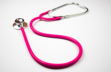 Medical stethoscope pink on an isolated background. Stethoscope, medical phonendoscope.