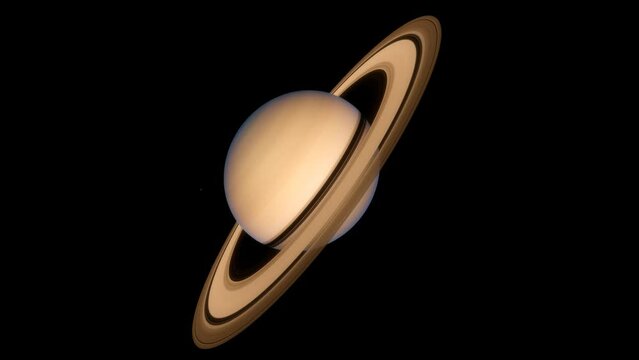 The gas giant Saturn with it's beautiful asteroid rings and a few small moons, seen in deep outer space in our solar system in a high quality 4K animation