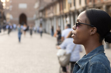 Portrait of turist woman dressed in white getting to know Europe, Ferrara. Italy