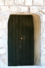 City entrance doors to a building in a big city in Israel.
