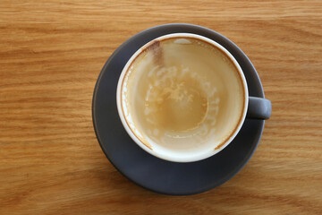 Coffee mugs placed on a table in a coffee shop.