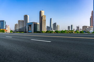 Fototapeta na wymiar Road and modern city buildings landscape skyline