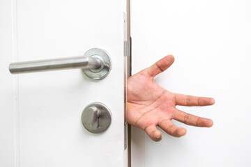 Hand clamped door. A young man shut the door of the house so carelessly and clumsily that the door...