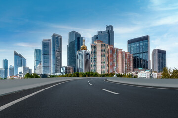 Fototapeta na wymiar Road and modern city buildings landscape skyline