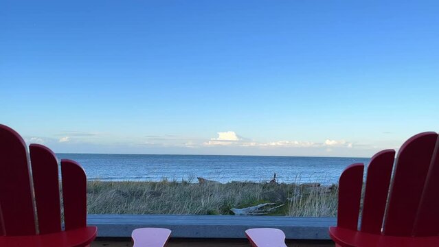 Seascape View From The Coast With Empty Wooden Chairs In Sequim, Washington. timelapse