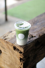Iced matcha green tea with green straw