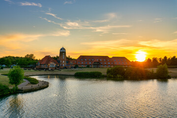 Old windmill on Caldecotte lake at sunset in Milton Keynes. England