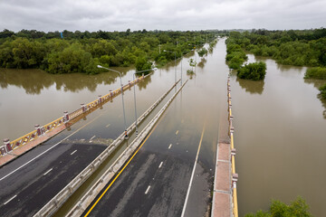 High-angle view of the Great Flood, Meng District, Thailand, on October 3, 2022, is a photograph from real flooding. With a slight color adjustment 