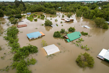 High-angle view of the Great Flood, Meng District, Thailand, on October 3, 2022, is a photograph from real flooding. With a slight color adjustment 