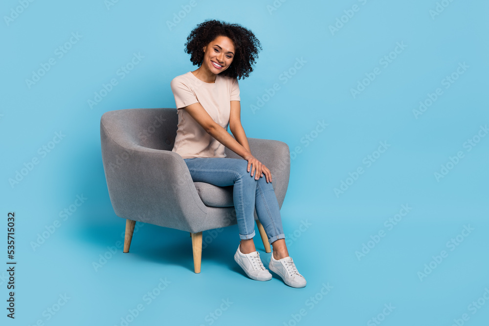 Canvas Prints full size photo of sweet brunette millennial lady sit wear t-shirt jeans shoes isolated on blue colo