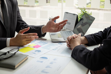 Business leaders talk about charts, financial graphs showing results are analyzing and calculating...
