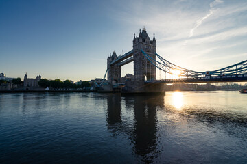 Fototapeta na wymiar Tower Bridge with sunrise flare in London. England