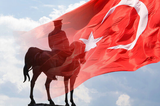 Silhouette of Ataturk Monument and Turkish Flag. Republic day of Turkey or Cumhuriyet bayrami background photo.