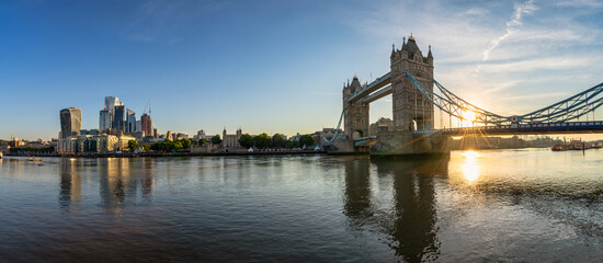 Tower Bridge and city of London financial district at sunrise. England