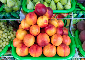 Peaches on the counter in the market.