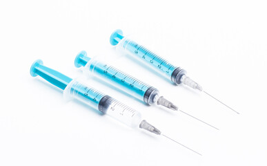 Medical syringe on a white background. A syringe for injection. The concept of health and beauty