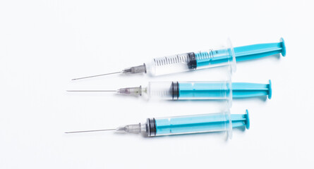 Medical syringe on a white background. A syringe for injection. The concept of health and beauty