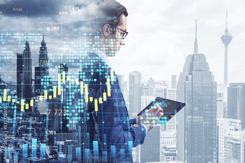 Poster  businessman using pad with creative forex chart with candlestick graph, index and tech hologram on blurry white daylight toning city background. Trade, success, ceo, executive, stock