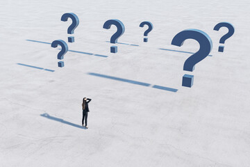 Find solution and right decision concept with confused businesswoman on empty concrete field in...