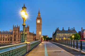Big Ben and Westminster bridge at dawn in London. England