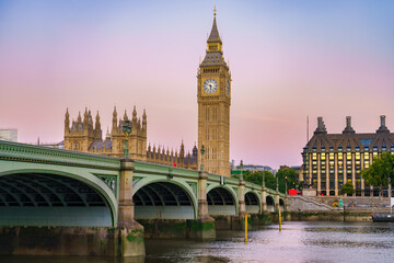 Fototapeta na wymiar Big Ben and Westminster bridge at sunrise in London. England