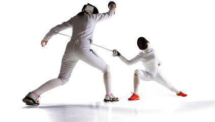 Fototapeta na wymiar Two female fencing athletes fight isolated on white
