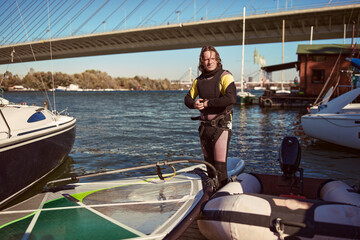 Windsurfer surfing on a windy day at the river.
