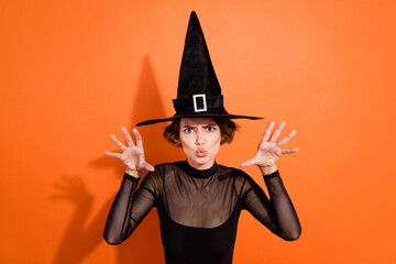 Photo portrait of nice young lady say boo witch frighten disobedient kids dressed trendy black...