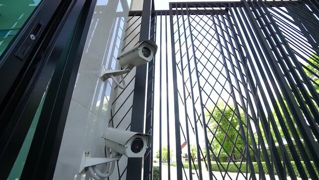 Two White Outdoor CCTV Camera at the Entry of Property, Close Up, No People