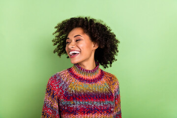 Photo of crazy satisfied lady look empty space toothy smile isolated on green color background