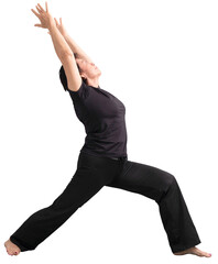 asian senior woman in black dress doing yoga at home, standing and stretching arms. Cutout....