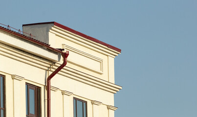 building with blue sky and white clouds