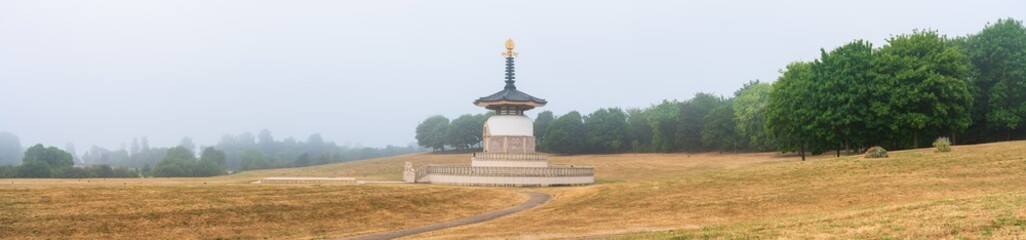 Peace Pagoda temple with morning mist at Wllen Park, Milton Keynes