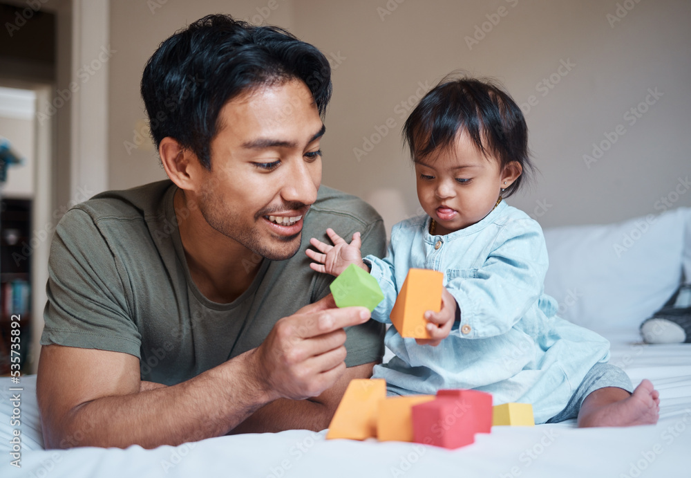 Poster Baby, down syndrome and learning on a bed with child and father playing with educational blocks in a bedroom. Family, disability and kids bonding with asian parent, relax with creative activity