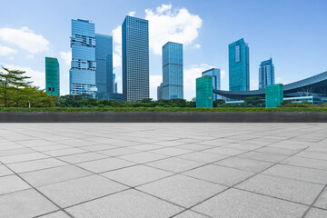 empty pavement and modern buildings in city