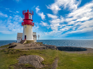 Fototapeta na wymiar The fanous Lindesnes Lighthouse (Lindesnes fyr) at the southernmost tip of Norway, Agder county.