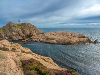 The fanous Lindesnes Lighthouse (Lindesnes fyr) at the southernmost tip of Norway, Agder county. - obrazy, fototapety, plakaty