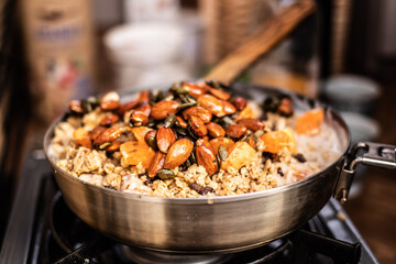 Porridge with almonds cooking outdoor