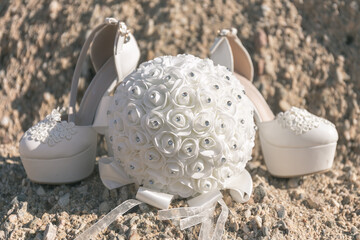 the bride's shoes on the beach