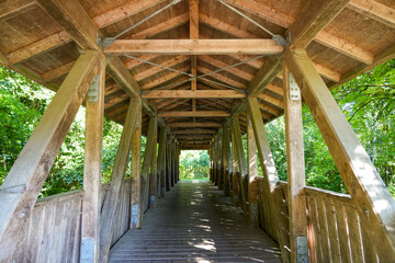 Fulda Bridge in the Fulda Valley. Pedestrian and cyclist bridge made of a wooden structure.
