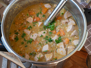 Pot with savory homemade stew in a pressure cooker