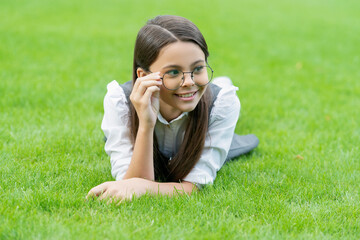 Teenager with smiling face. Portrait of happy girl teenager adjusting glasses after school, teenager