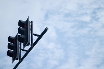 traffic lights and blue sky and soft cloud, red light on traffic signs 