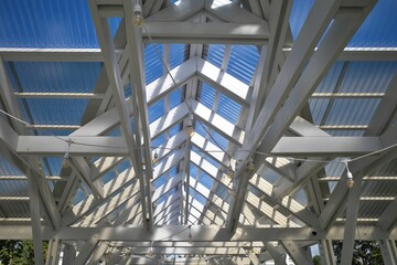 Canopy made of polycarbonate with a wooden structure roof.