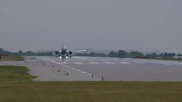 Passenger plane taking off from Milan airport.