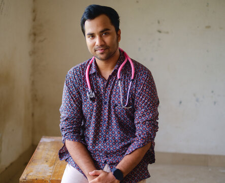 South Asian Young Male Doctor In Casual Shirt Holding A Stethoscope 