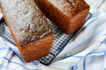 Freshly baked homemade rye bread on a textile background. Close-up, selective focus