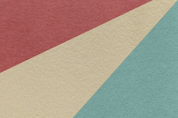 Fototapeta premium Texture of old craft beige, blue and maroon color paper background, macro. Vintage abstract cerulean cardboard.