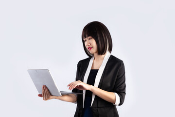 Asian Businesswoman short hair style using laptop on white background.